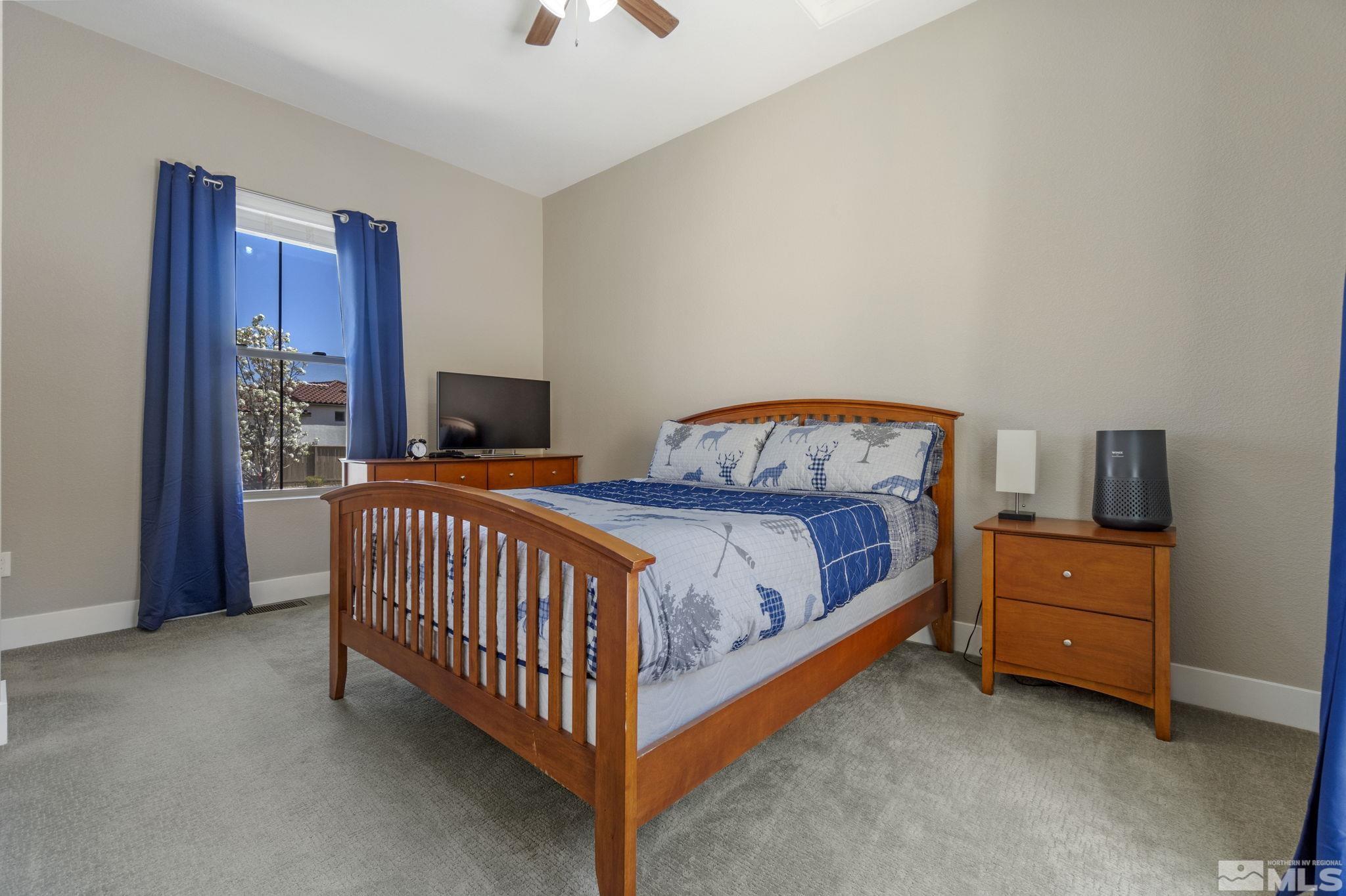 13357 Travertine Lane Reno, NV 89511 - Photo 32 of 39 a bedroom with a bed and a window