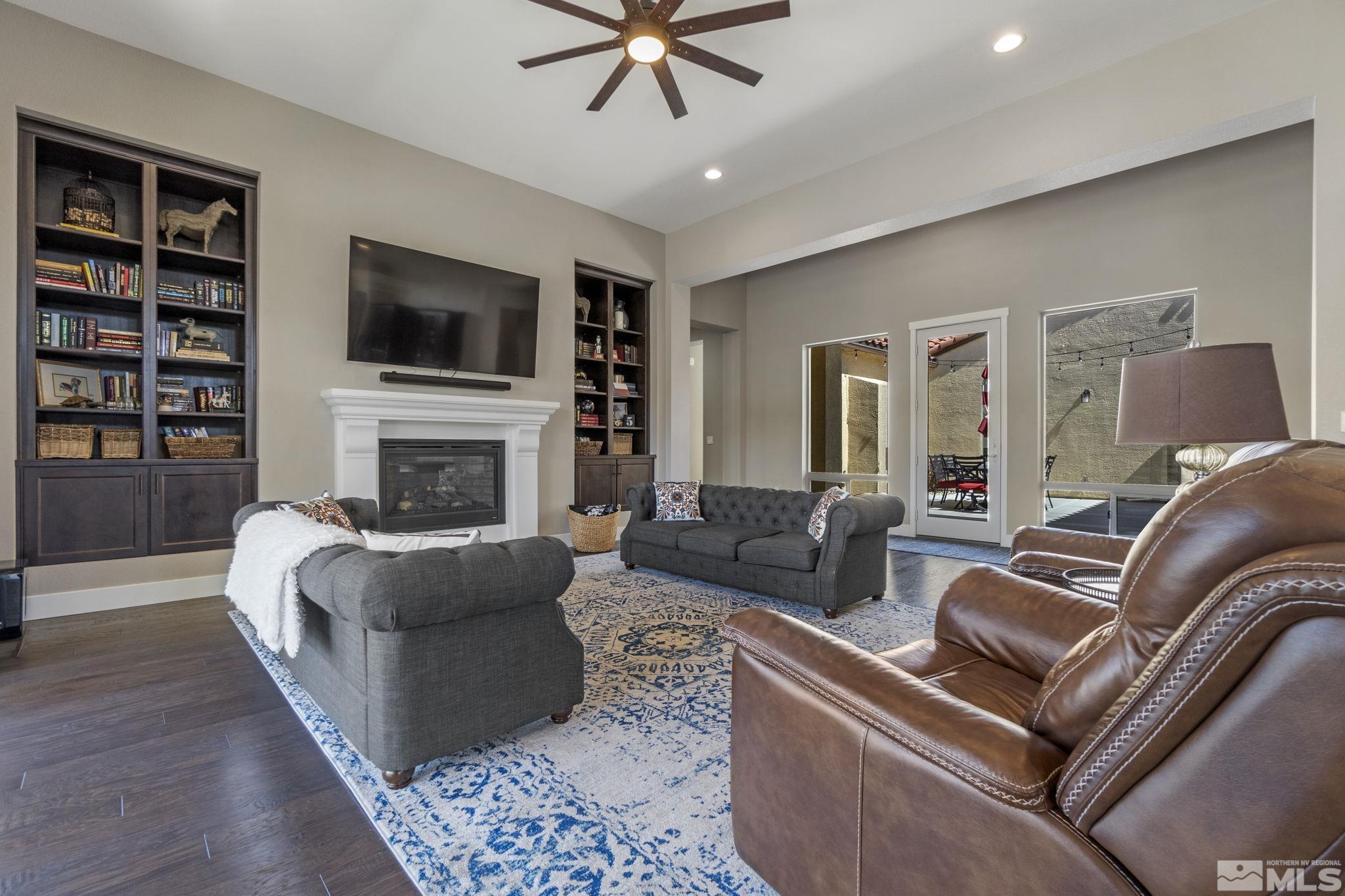 13357 Travertine Lane Reno, NV 89511 - Photo 9 of 39 a living room with furniture fireplace and flat screen tv