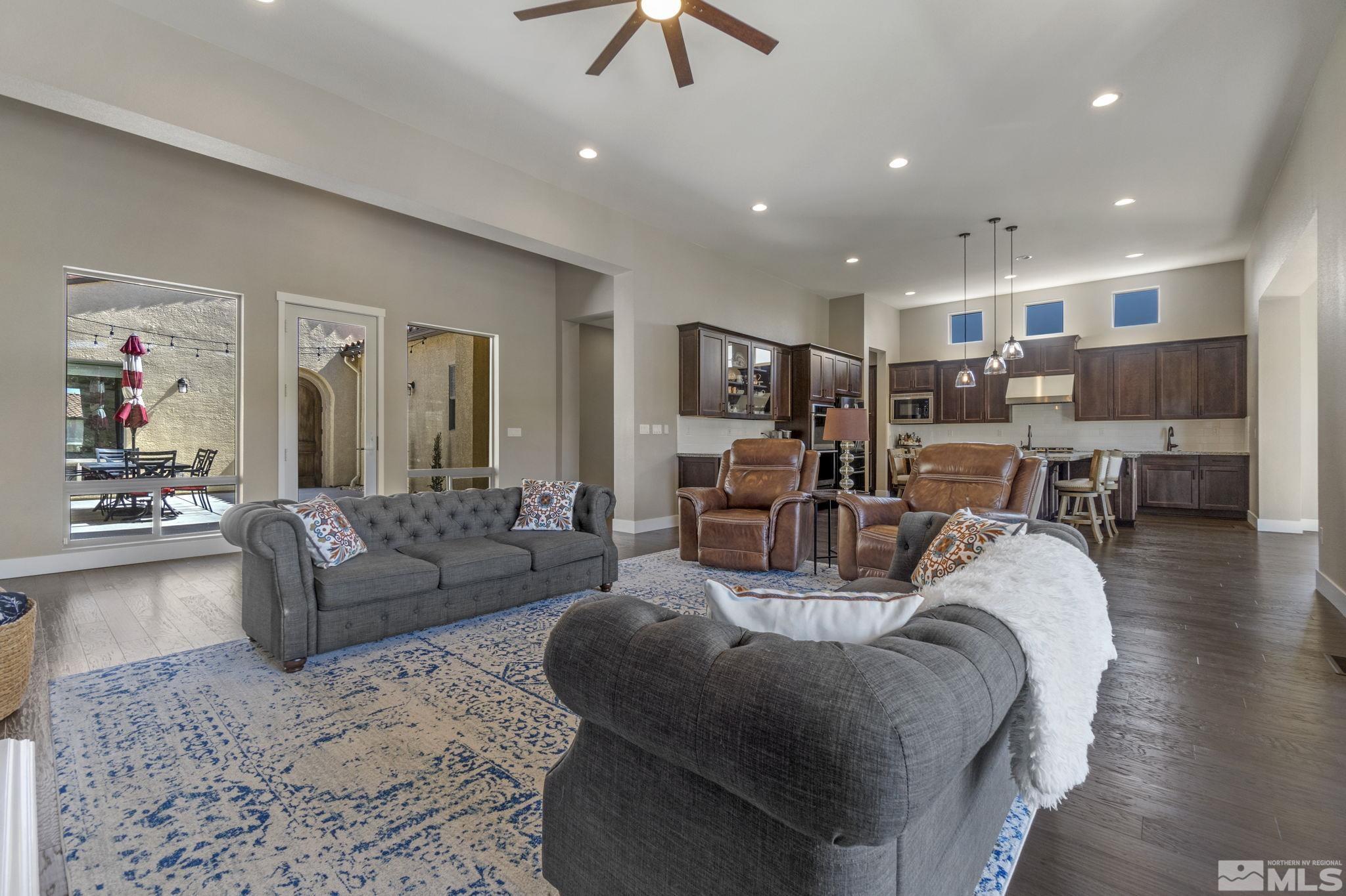13357 Travertine Lane Reno, NV 89511 - Photo 10 of 39 a living room with furniture and a chandelier