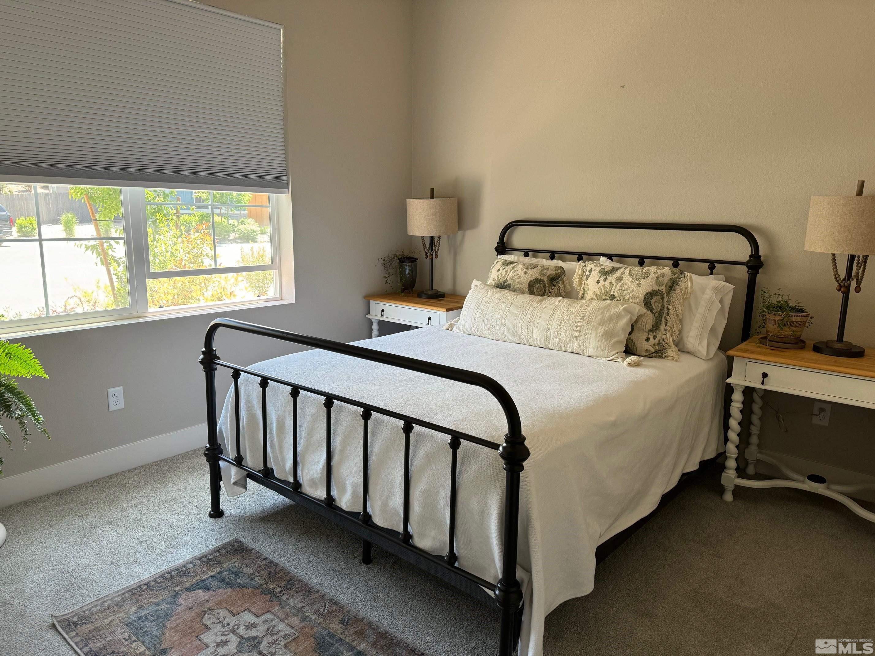 2833 Thistle Pine Court Reno, NV 89521 - Photo 11 of 25 a bedroom with a bed and window