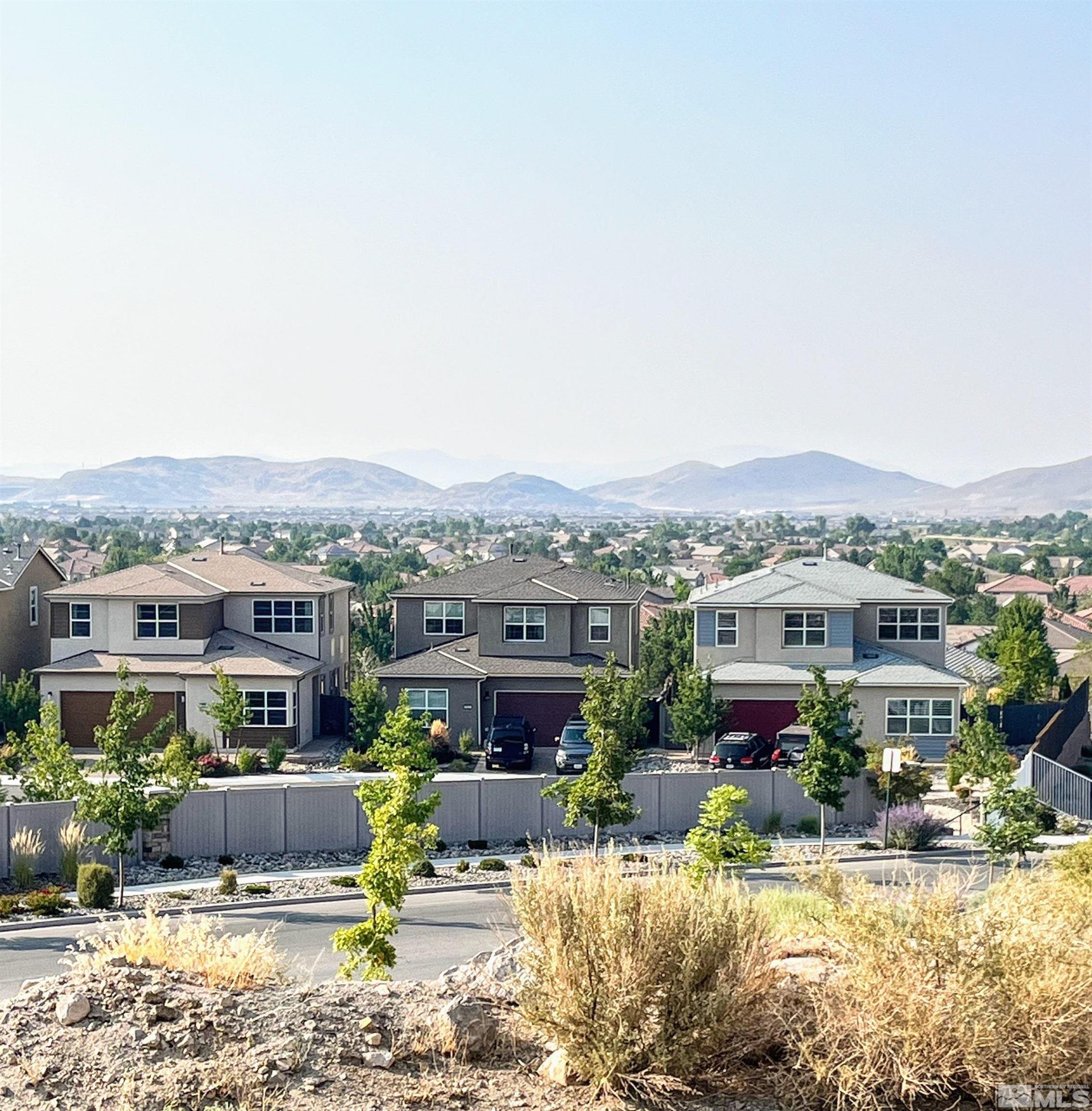 2833 Thistle Pine Court Reno, NV 89521 - Photo 25 of 25 an aerial view of a house with a yard and lake view
