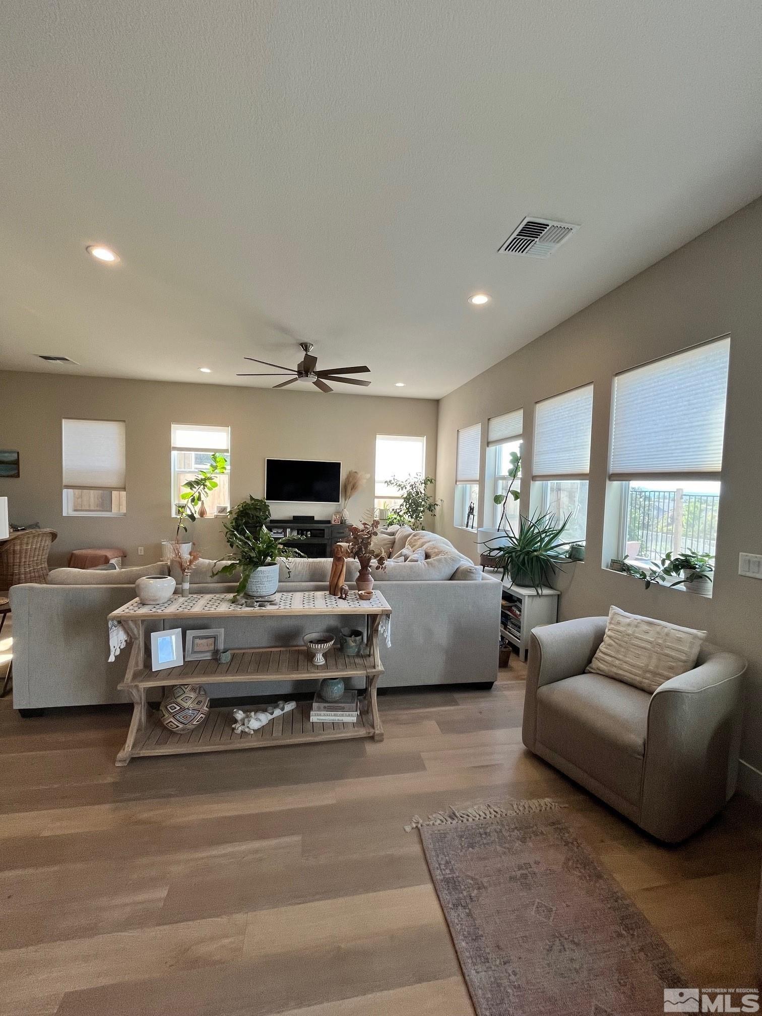 2833 Thistle Pine Court Reno, NV 89521 - Photo 4 of 25 a living room with furniture and a flat screen tv