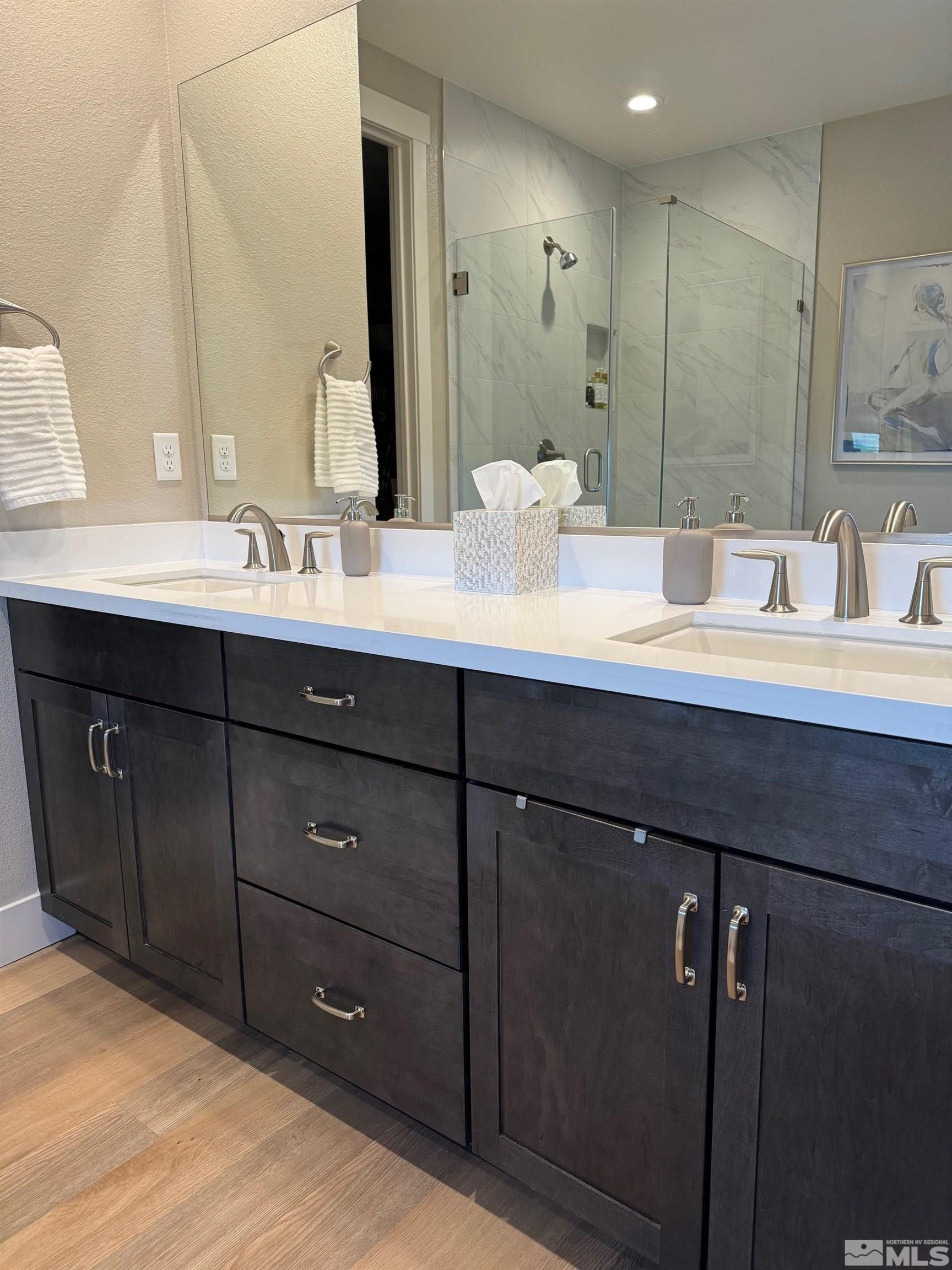 2833 Thistle Pine Court Reno, NV 89521 - Photo 9 of 25 a bathroom with a double vanity sink and a mirror