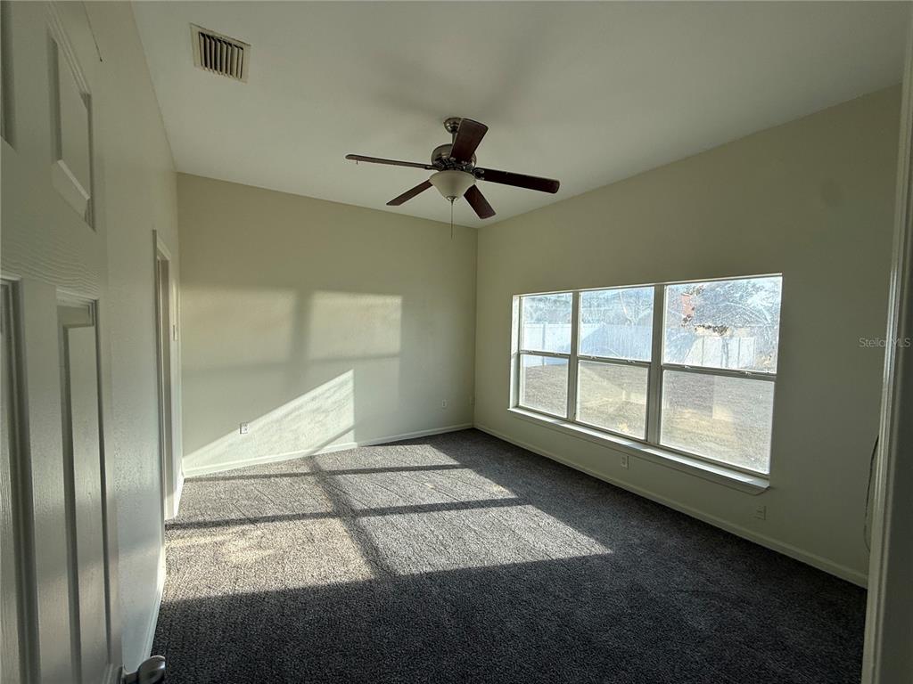 5000 Southwest 40th Place Ocala, FL 34474 - Photo 11 of 19 a view of an empty room with a window
