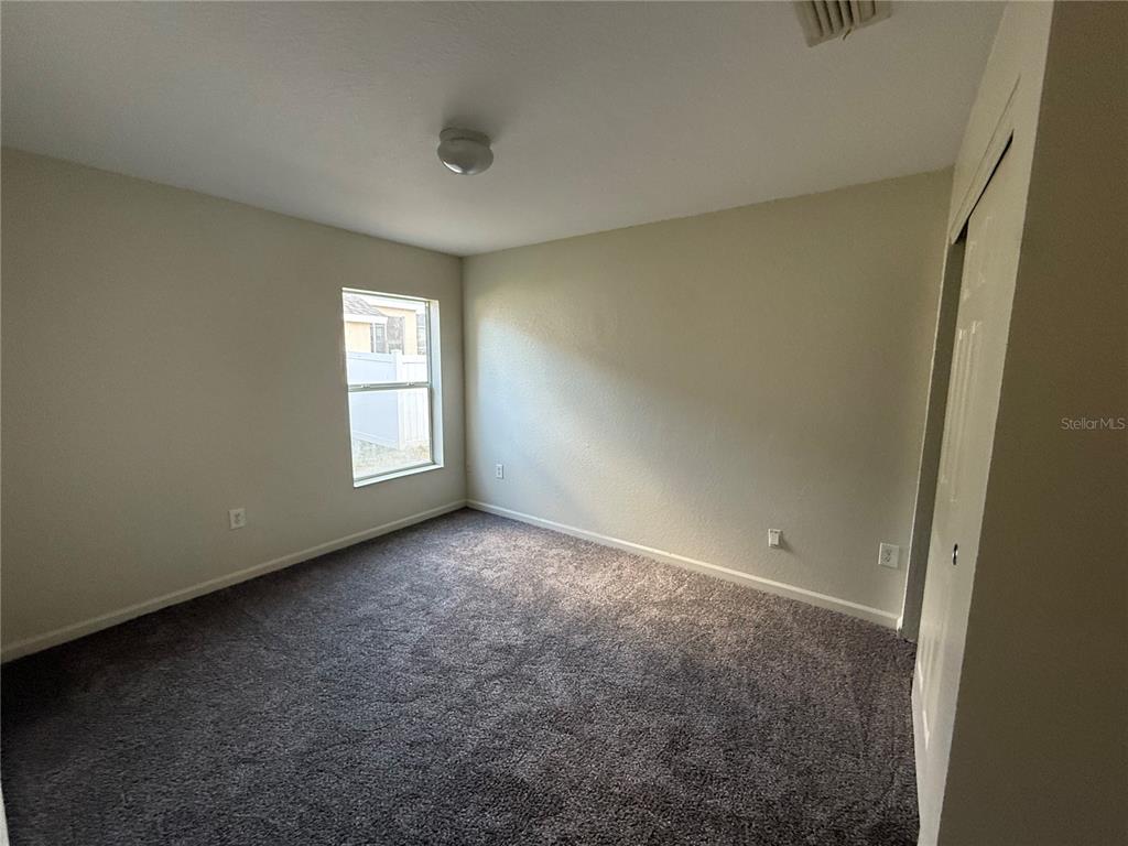 5000 Southwest 40th Place Ocala, FL 34474 - Photo 16 of 19 an empty room with windows and closet