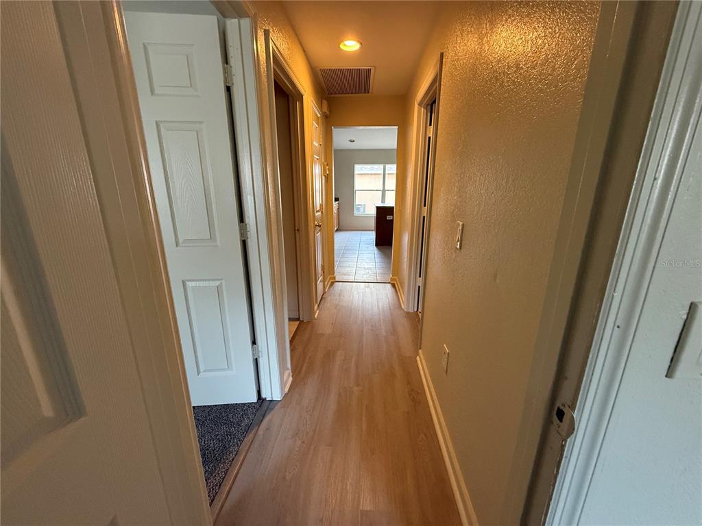 5000 Southwest 40th Place Ocala, FL 34474 - Photo 18 of 19 a view of a hallway with wooden floor