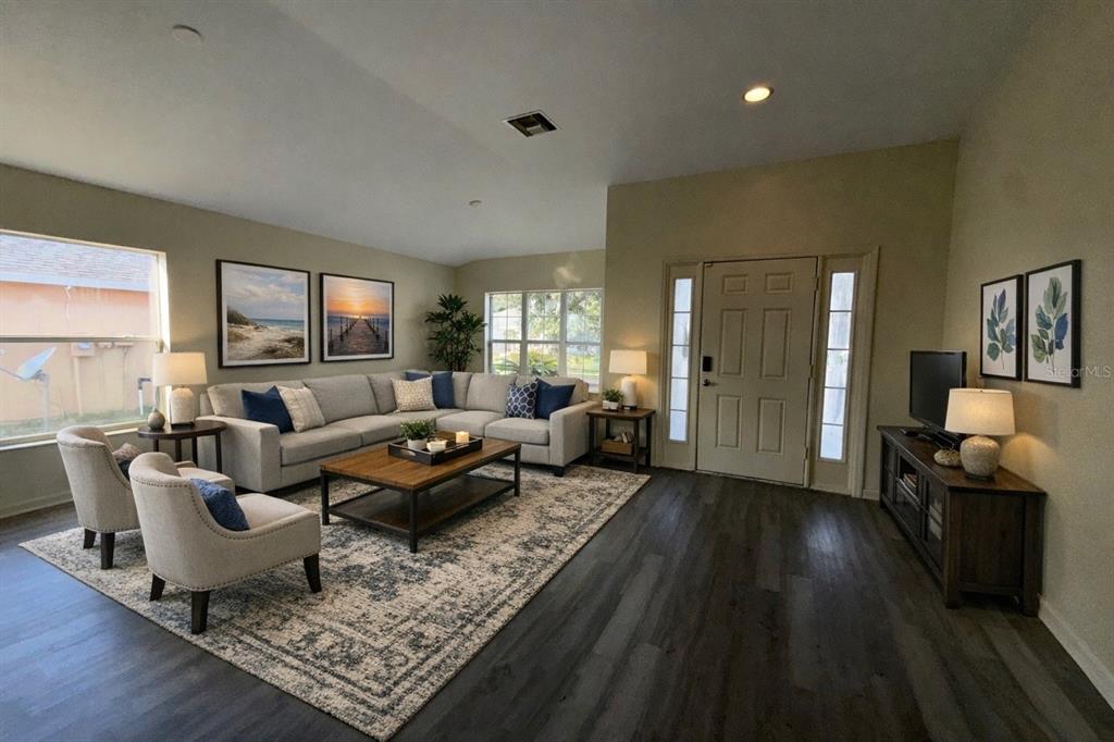 5000 Southwest 40th Place Ocala, FL 34474 - Photo 7 of 19 a living room with furniture and a wooden floor