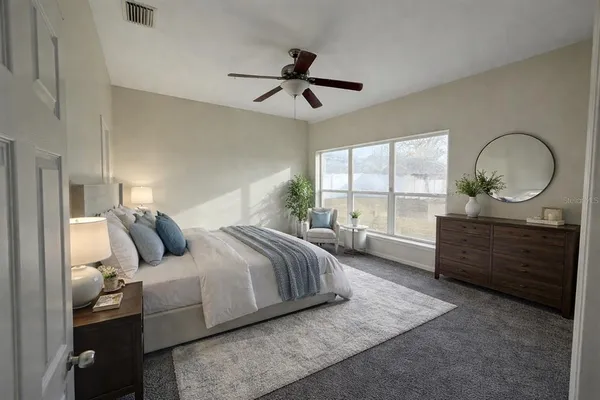 a bed room with a bed and a dresser