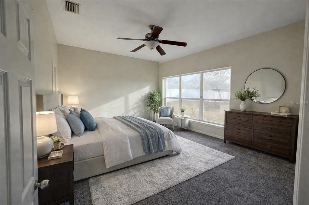 5000 Southwest 40th Place Ocala, FL 34474 - Photo 10 of 19 a bed room with a bed and a dresser