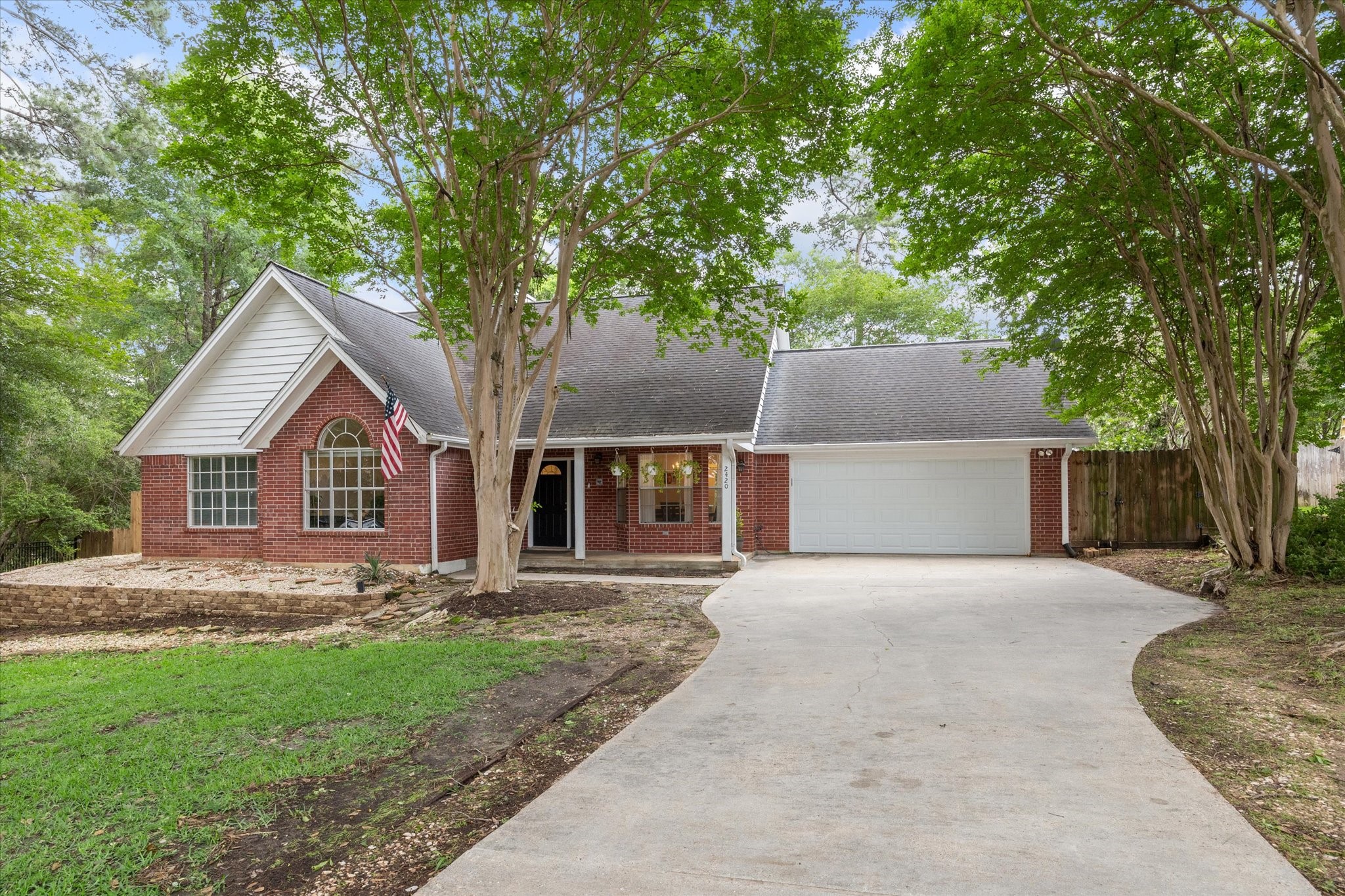 2420 Canter Lane Conroe, TX 77384 - Photo 3 of 24 front view of a house with a yard