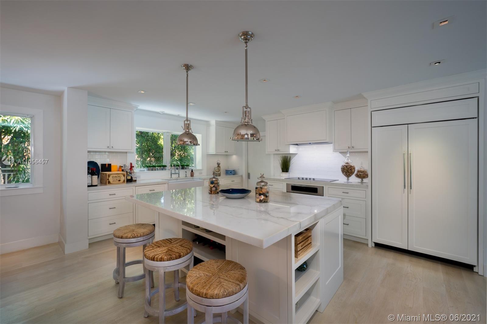 320 Pacific Road Key Biscayne, FL 33149 - Photo 16 of 27 a view of kitchen island with stainless steel appliances granite countertop a stove and a sink