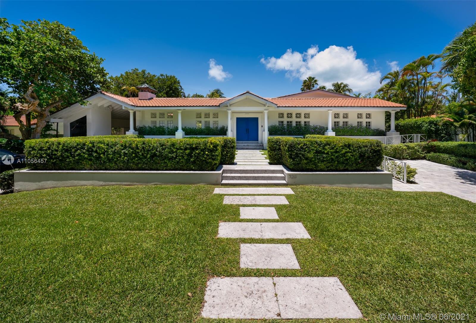320 Pacific Road Key Biscayne, FL 33149 - Photo 20 of 27 a front view of a house with a yard