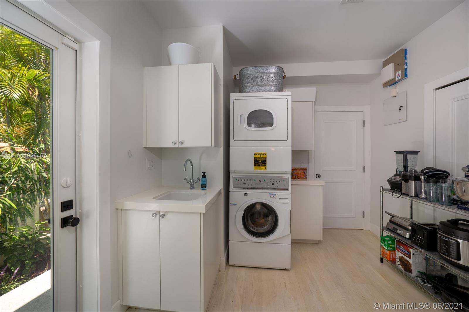 320 Pacific Road Key Biscayne, FL 33149 - Photo 23 of 27 a utility room with dryer and washer