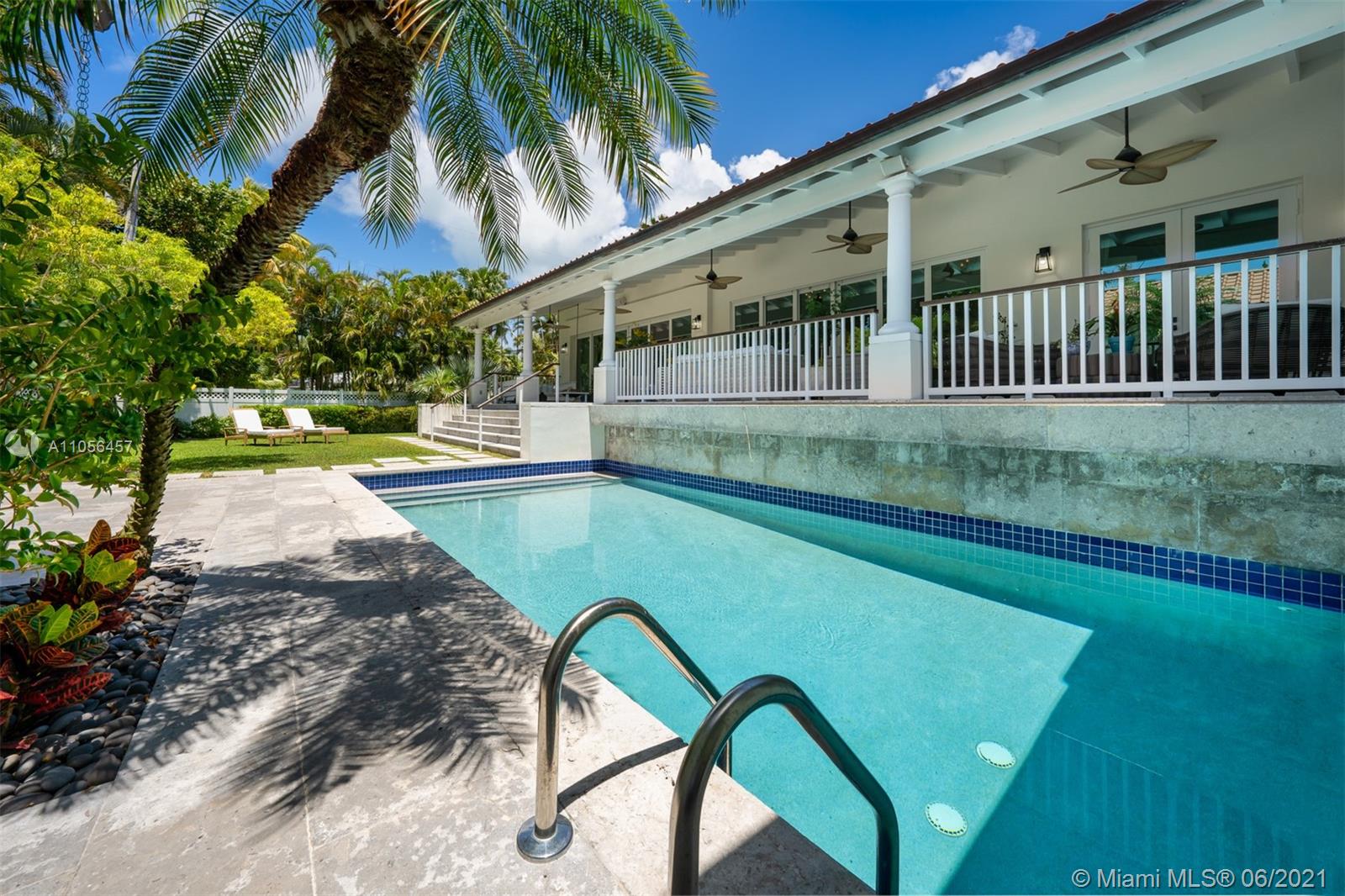 320 Pacific Road Key Biscayne, FL 33149 - Photo 5 of 27 a view of swimming pool with a table and chairs
