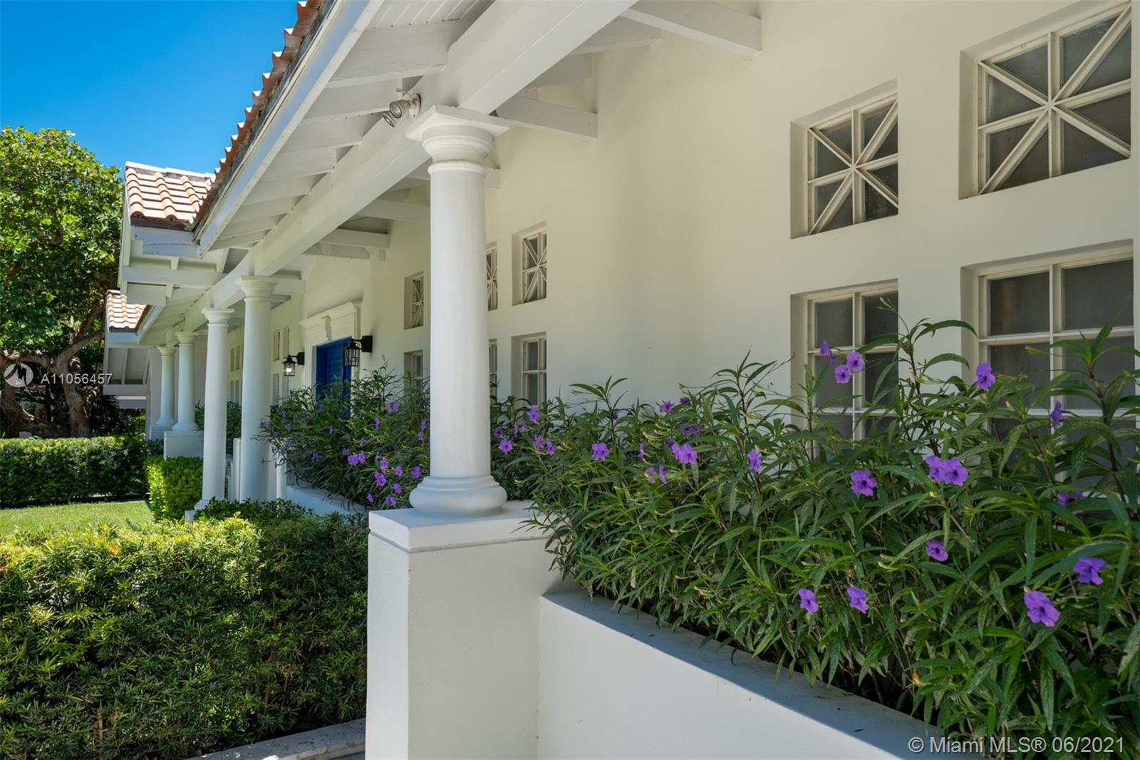 320 Pacific Road Key Biscayne, FL 33149 - Photo 10 of 27 a front view of a house with a yard