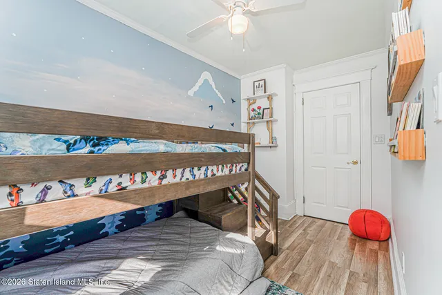 a bed room with a bed and a book shelf