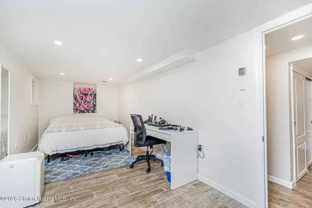 a bedroom with a bed and a table in it