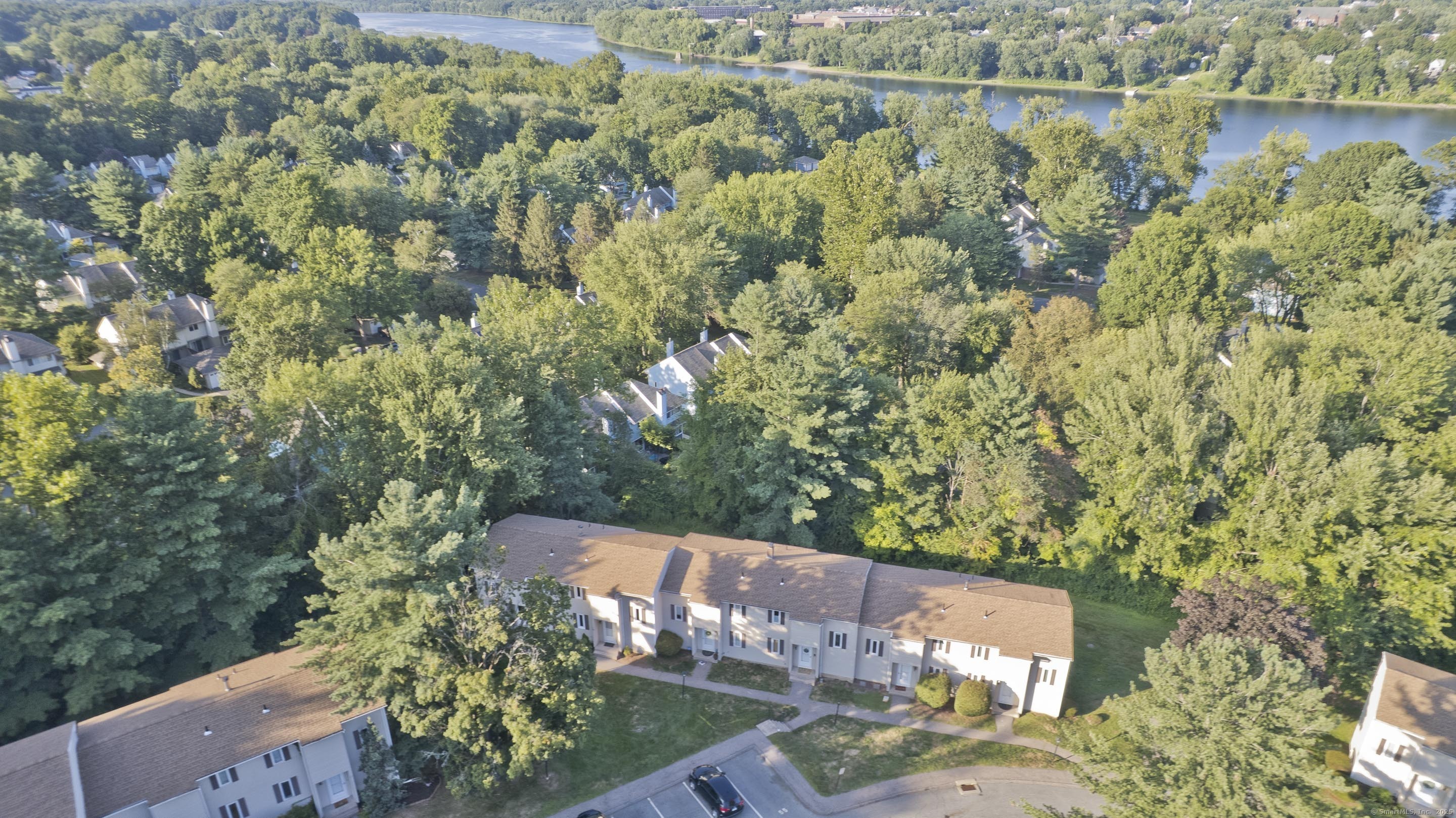 an aerial view of a house with a yard
