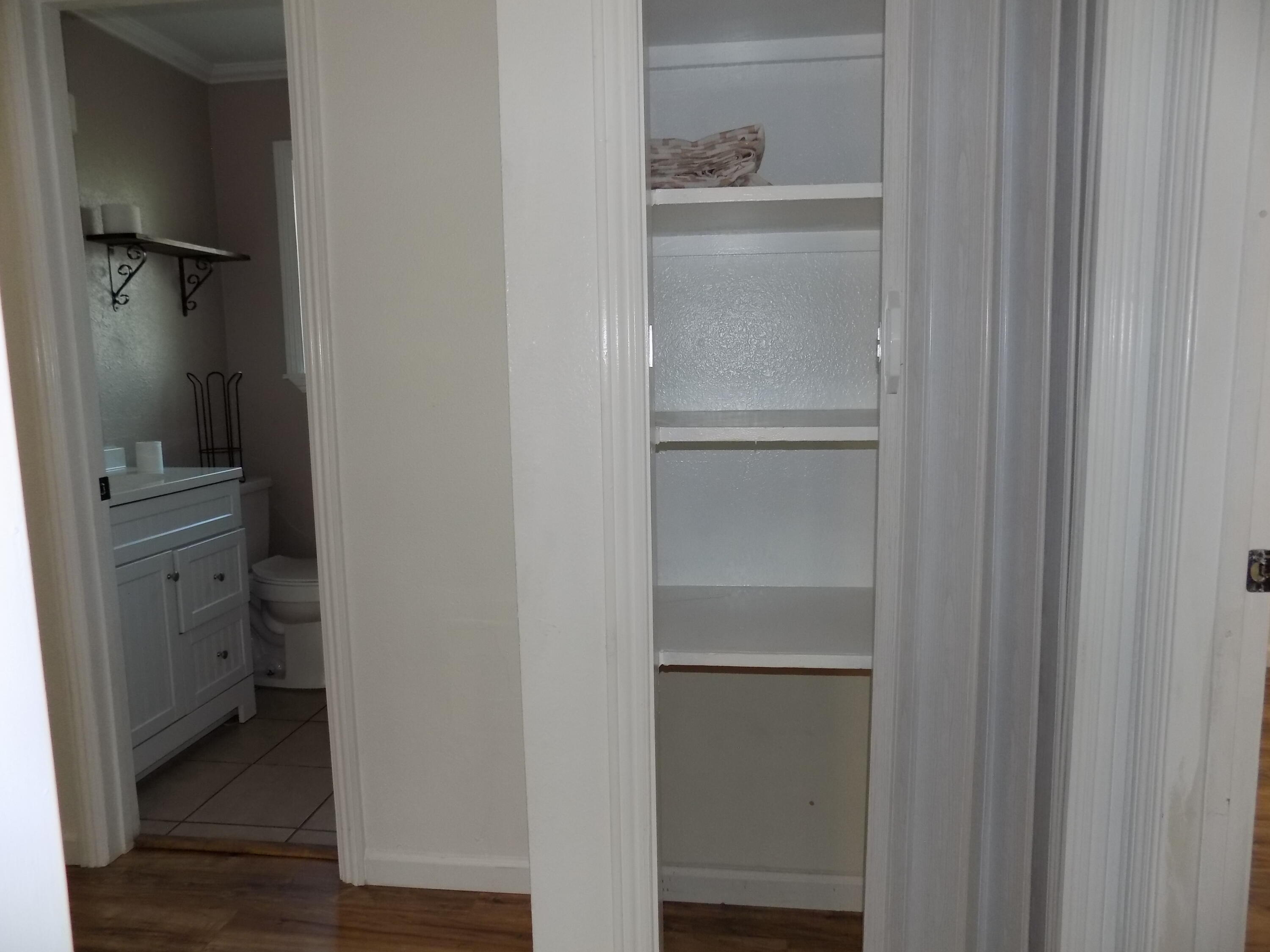 7658 Happy Valley Road Anderson, CA 96007 - Photo 18 of 25 a walk in closet with wooden floor