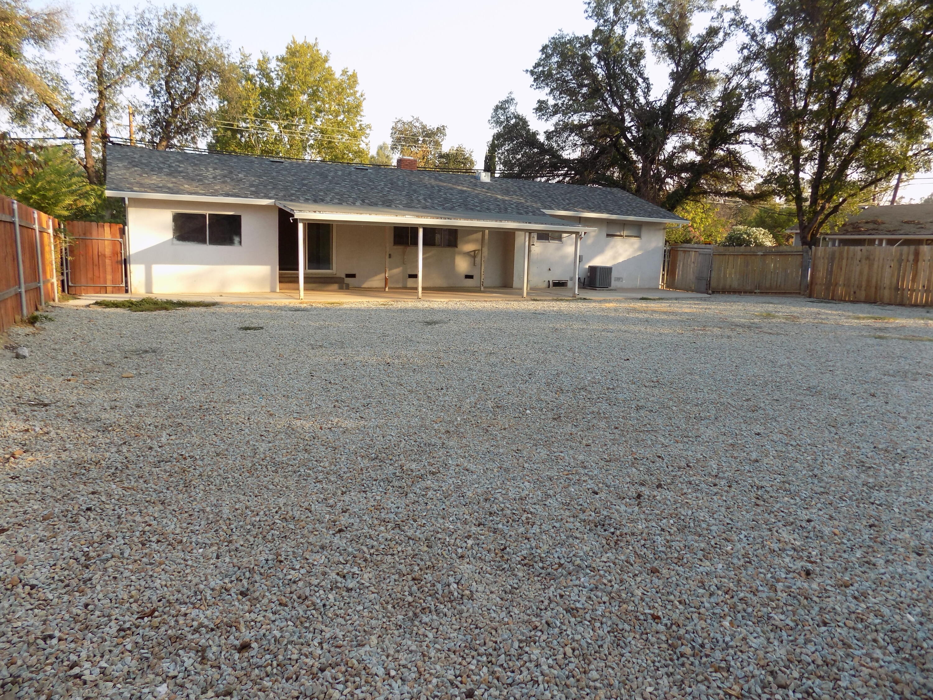 7658 Happy Valley Road Anderson, CA 96007 - Photo 23 of 25 a front view of house with yard and trees