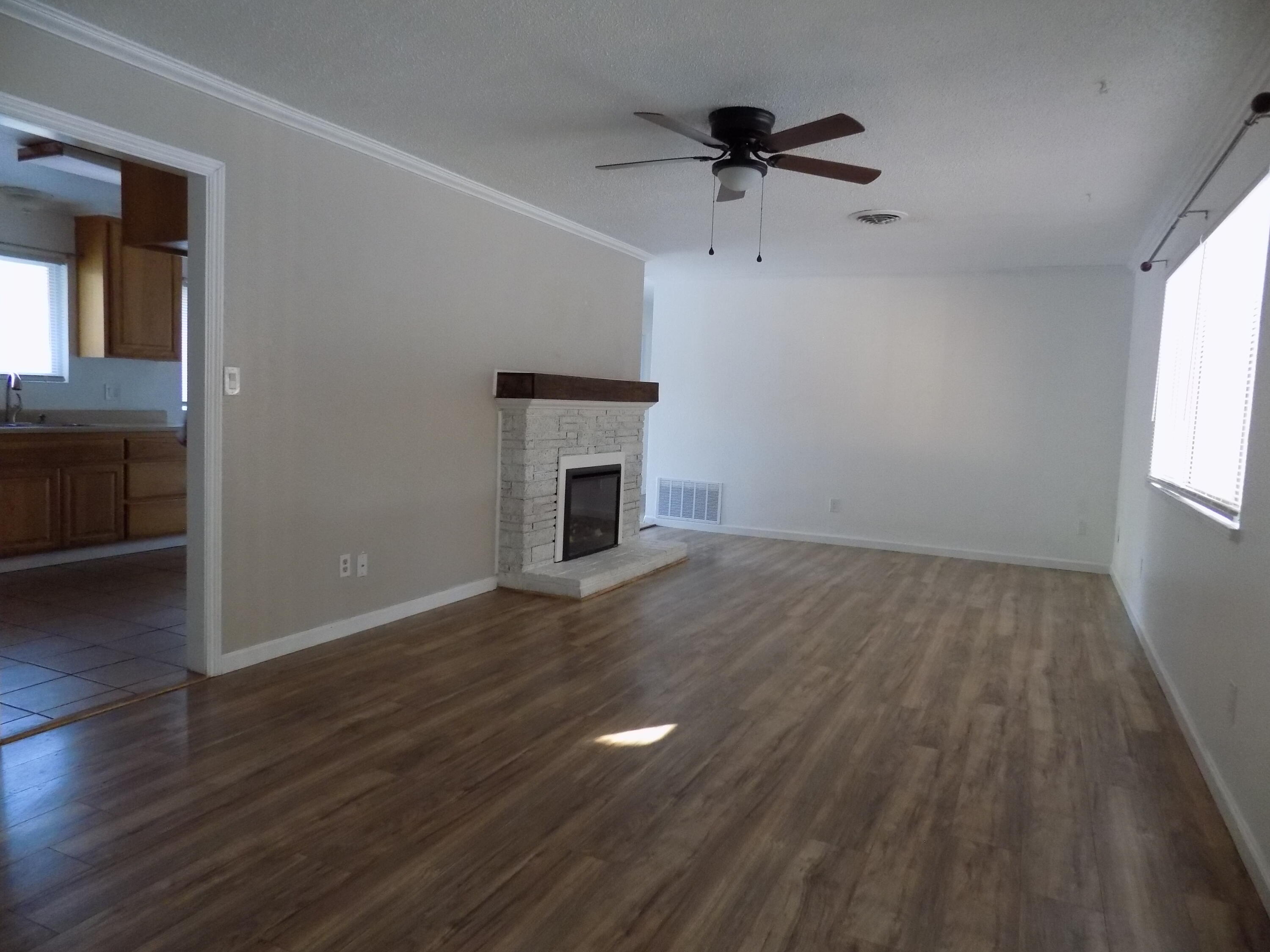 7658 Happy Valley Road Anderson, CA 96007 - Photo 7 of 25 wooden floor in an empty room with a window