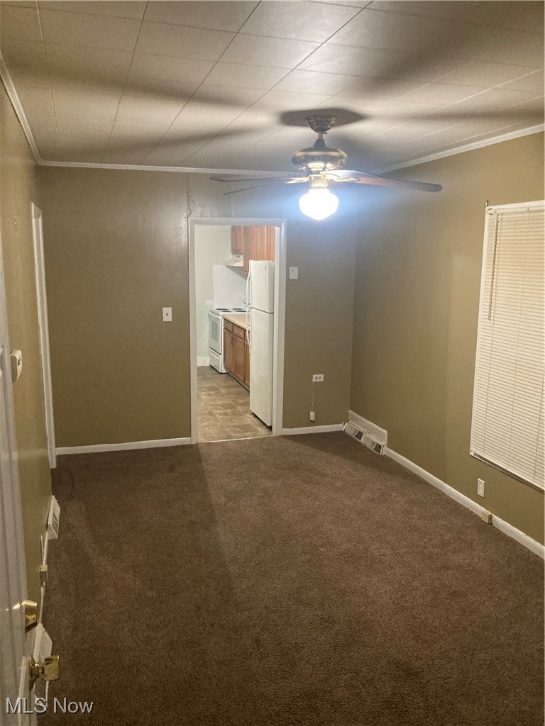 851 Springdale Street Akron, OH 44310 - Photo 4 of 22 Living room featuring ceiling fan and ornamental molding