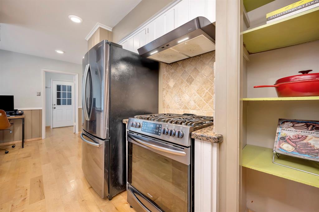 10005 Ridgehaven Drive Dallas, TX 75238 - Photo 12 of 27 a kitchen with stainless steel appliances granite countertop a refrigerator and a stove