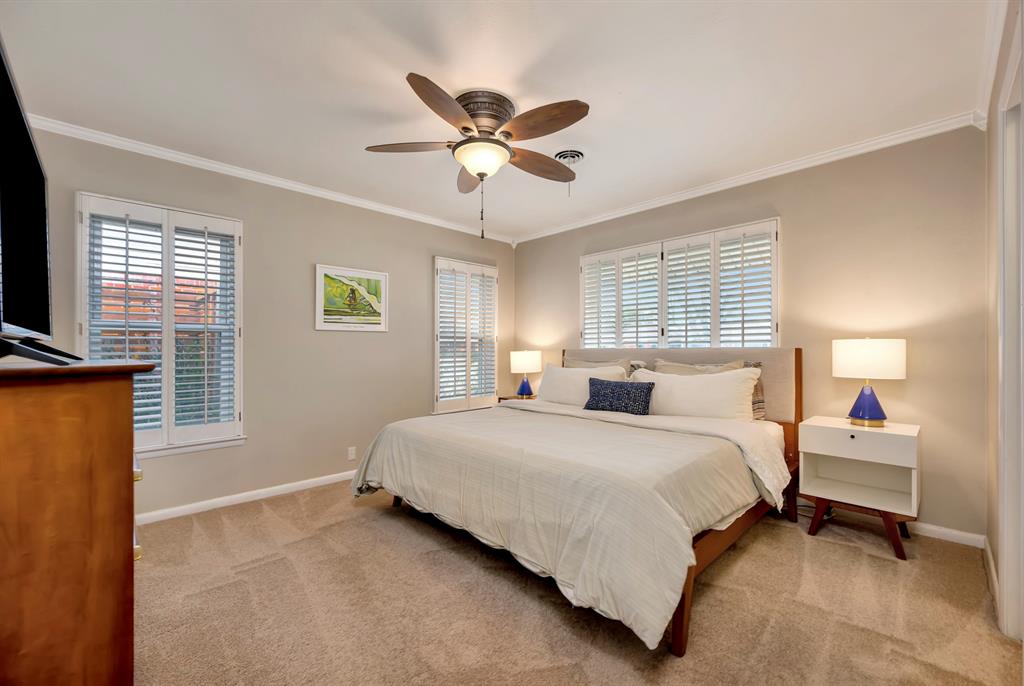 10005 Ridgehaven Drive Dallas, TX 75238 - Photo 18 of 27 a bedroom with a bed and a window