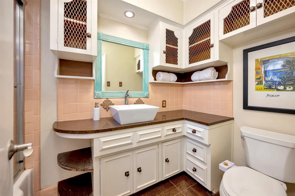 10005 Ridgehaven Drive Dallas, TX 75238 - Photo 19 of 27 a bathroom with a sink and a mirror