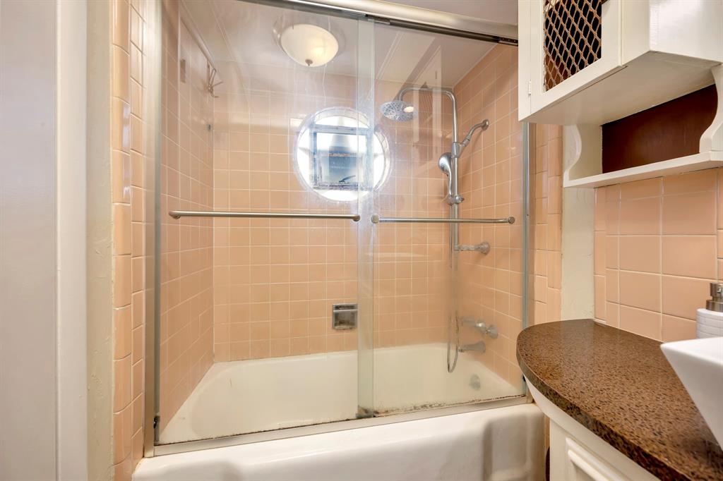 10005 Ridgehaven Drive Dallas, TX 75238 - Photo 20 of 27 a bathroom with a granite countertop bathtub shower and sink