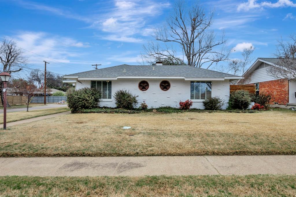 10005 Ridgehaven Drive Dallas, TX 75238 - Photo 2 of 27 a front view of a house with garden