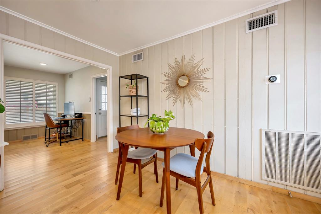10005 Ridgehaven Drive Dallas, TX 75238 - Photo 9 of 27 a view of a dining room with furniture and wooden floor