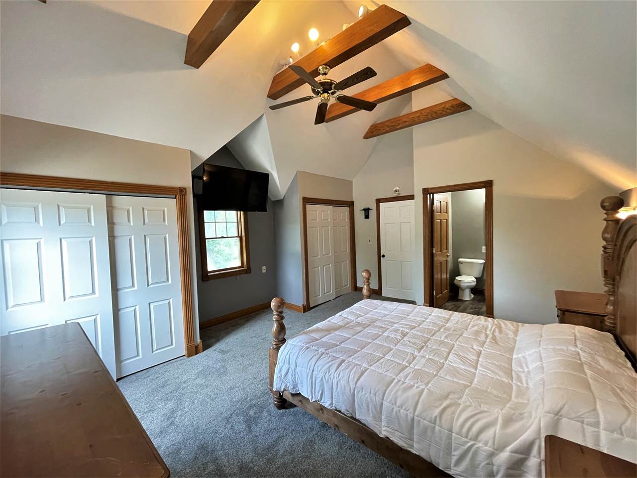 7545 Kishwaukee Road Stillman Valley, IL 61084 - Photo 34 of 61 a bed sitting in a spacious bedroom next to a window