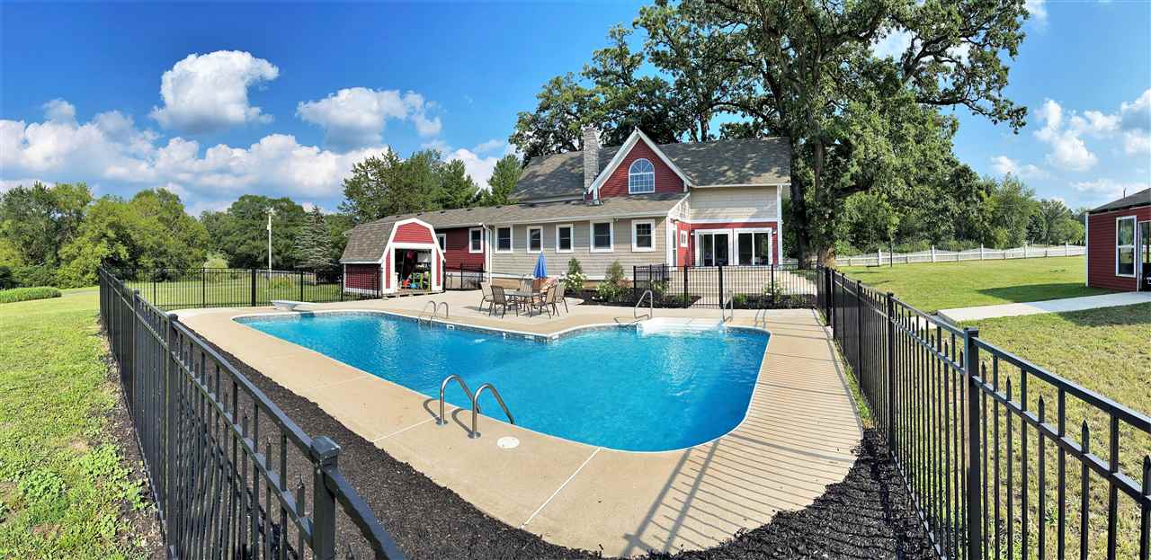 7545 Kishwaukee Road Stillman Valley, IL 61084 - Photo 48 of 61 a view of a house with swimming pool and sitting area