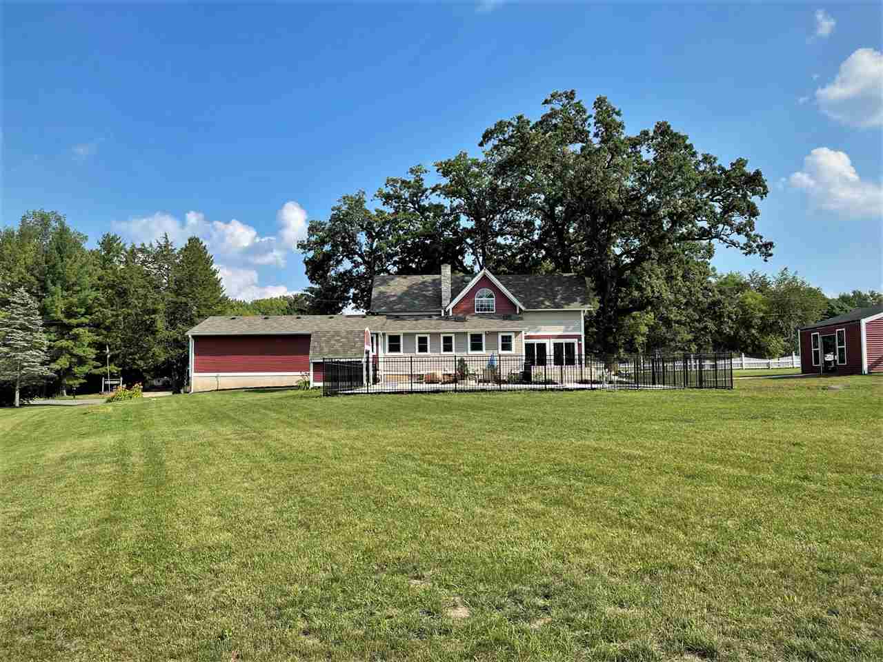 7545 Kishwaukee Road Stillman Valley, IL 61084 - Photo 52 of 61 a front view of a house with a garden