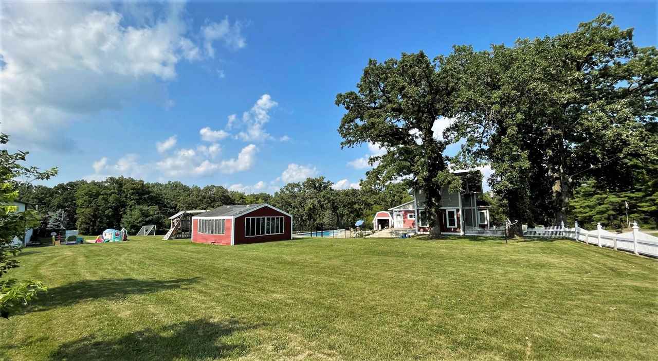 7545 Kishwaukee Road Stillman Valley, IL 61084 - Photo 58 of 61 a view of a house with a big yard