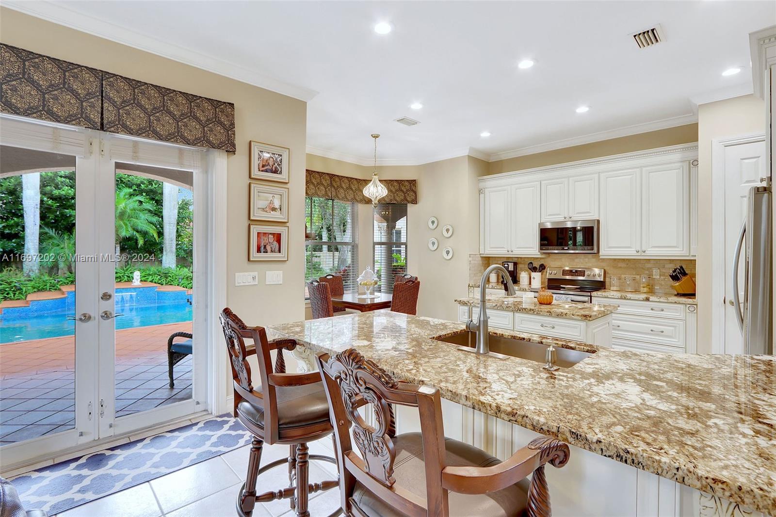 9750 Southwest 143rd Street Miami, FL 33176 - Photo 15 of 41 a view of a dining room with furniture window and outside view