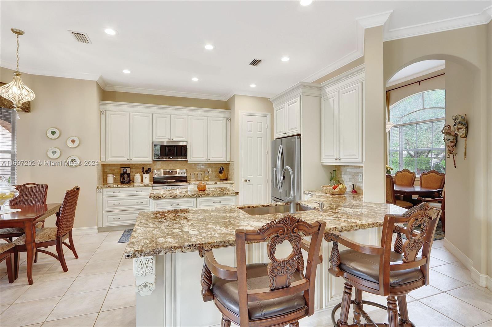 9750 Southwest 143rd Street Miami, FL 33176 - Photo 17 of 41 a view of a dining room kitchen and a window