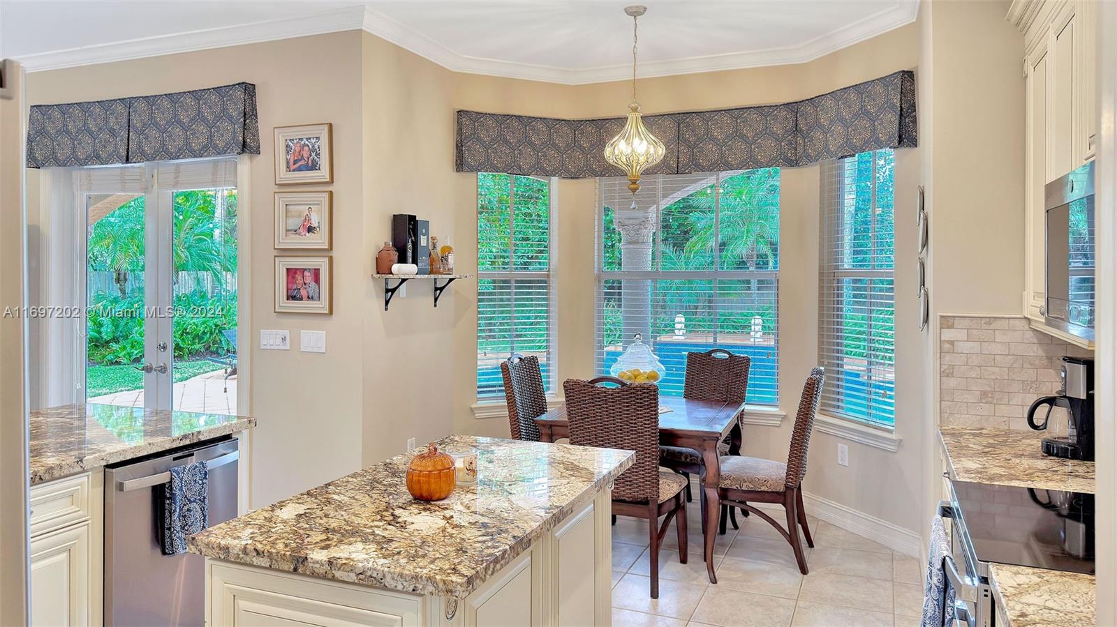 9750 Southwest 143rd Street Miami, FL 33176 - Photo 20 of 41 a view of a dining room with furniture window and outside view