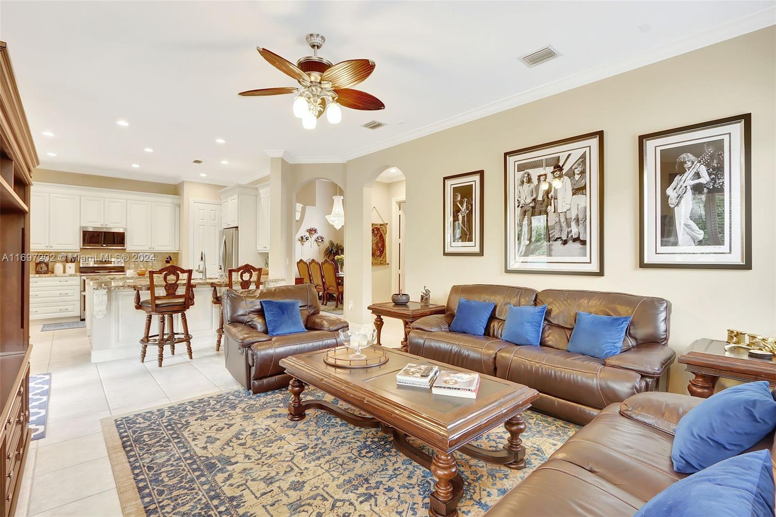 9750 Southwest 143rd Street Miami, FL 33176 - Photo 22 of 41 a living room with furniture wooden floor and a kitchen