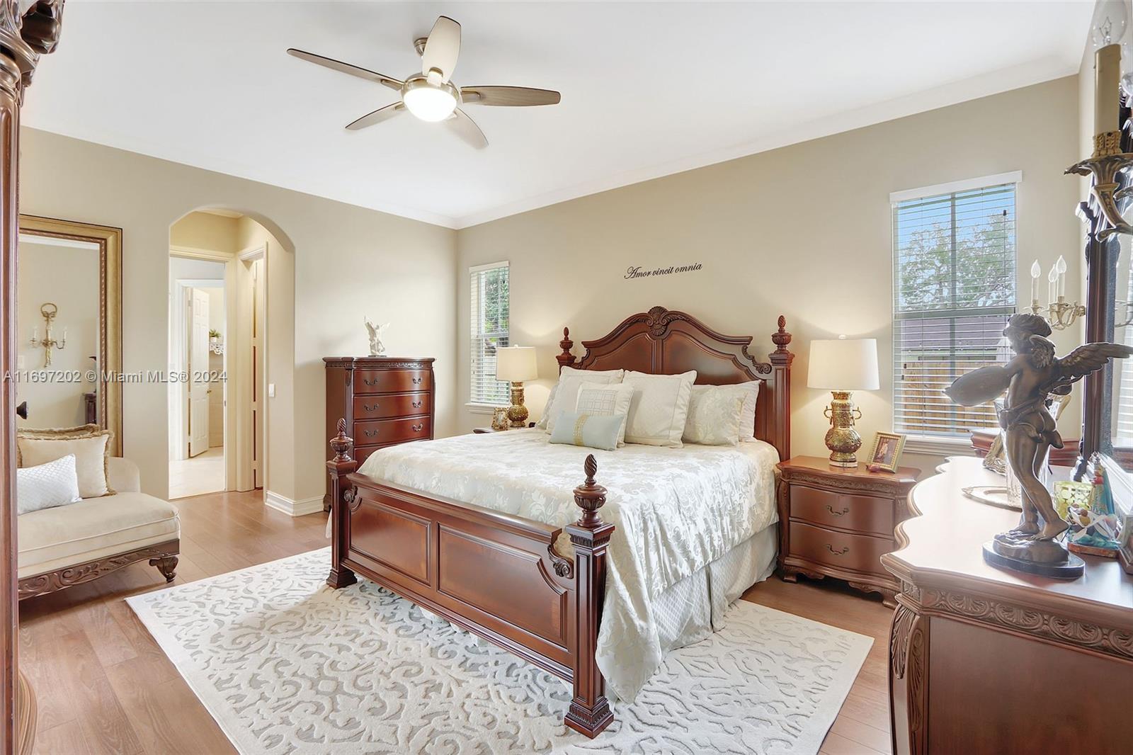 9750 Southwest 143rd Street Miami, FL 33176 - Photo 23 of 41 a bedroom with a bed and wooden floor