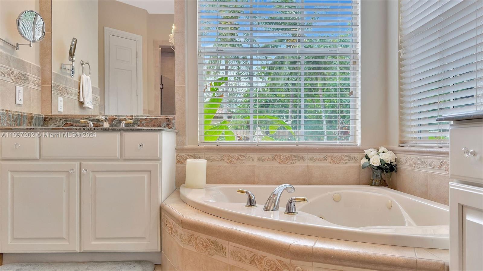 9750 Southwest 143rd Street Miami, FL 33176 - Photo 28 of 41 a bathroom with bathtub next to a window