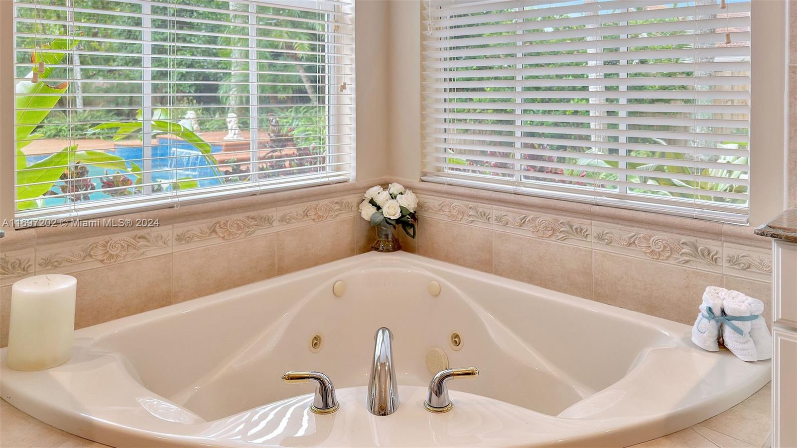 9750 Southwest 143rd Street Miami, FL 33176 - Photo 29 of 41 a bath tub sitting in a bathroom next to a window