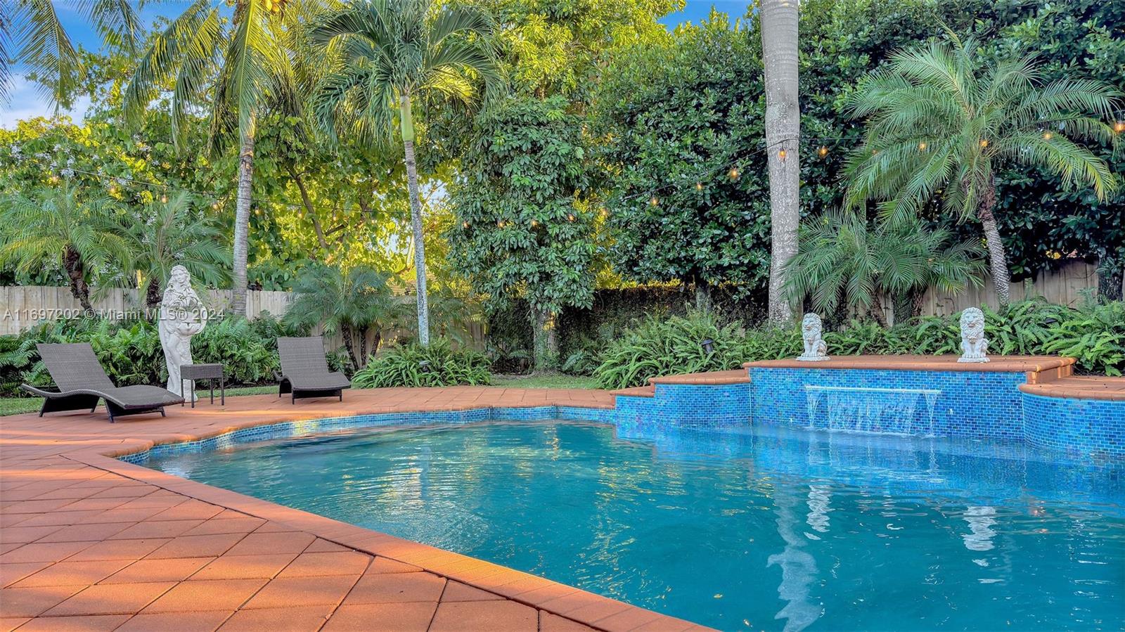 9750 Southwest 143rd Street Miami, FL 33176 - Photo 3 of 41 a view of swimming pool with a patio