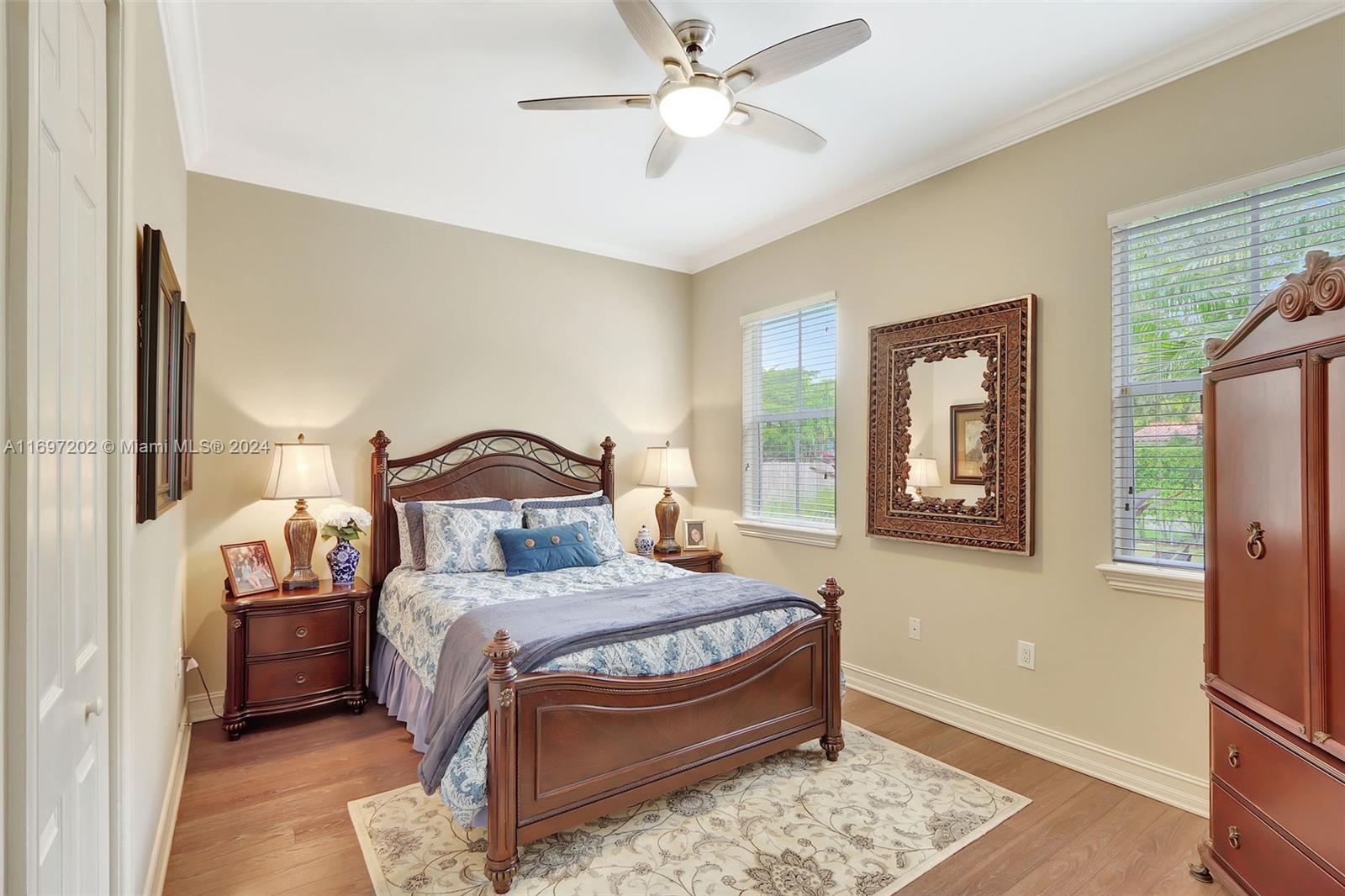 9750 Southwest 143rd Street Miami, FL 33176 - Photo 31 of 41 a bedroom with a bed and a window