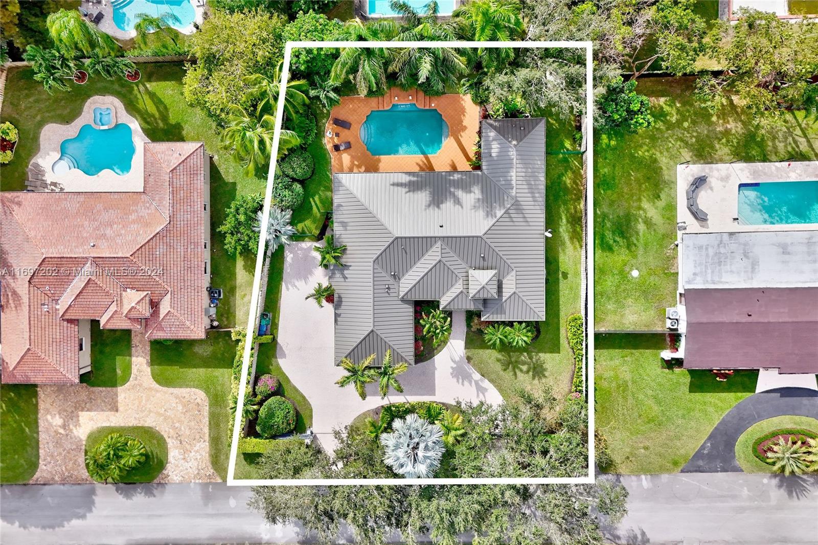 9750 Southwest 143rd Street Miami, FL 33176 - Photo 38 of 41 an aerial view of residential house with outdoor space and swimming pool