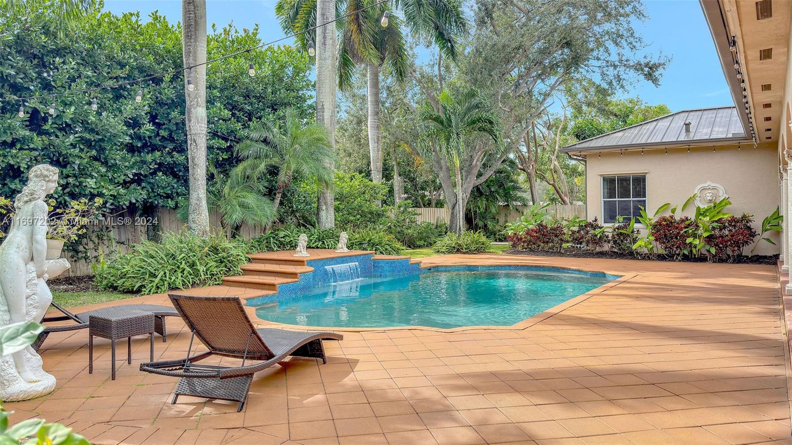 9750 Southwest 143rd Street Miami, FL 33176 - Photo 5 of 41 a view of swimming pool with sitting area