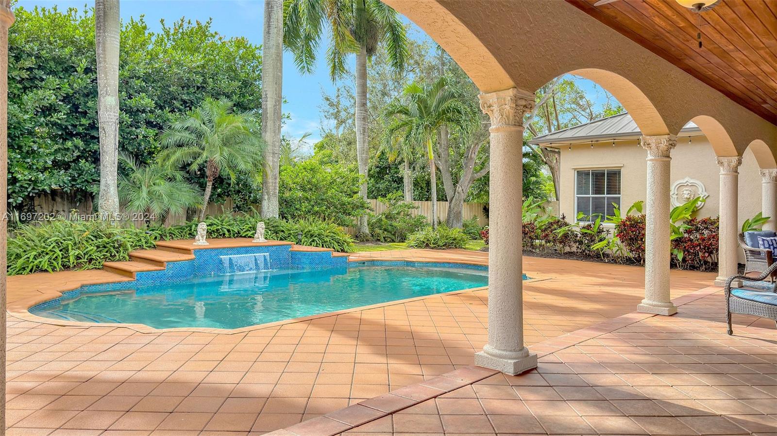 9750 Southwest 143rd Street Miami, FL 33176 - Photo 6 of 41 a view of a swimming pool with a patio