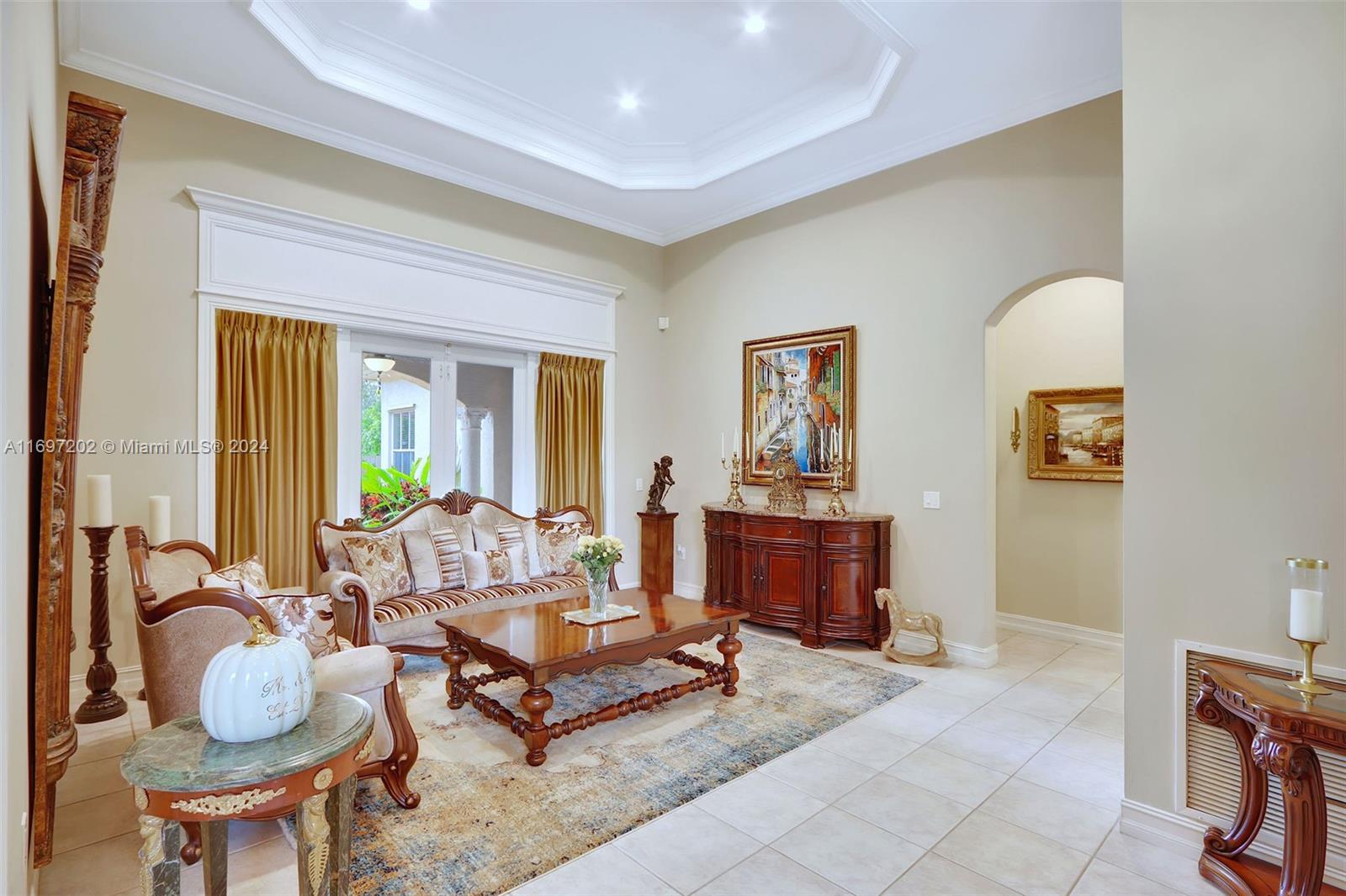 9750 Southwest 143rd Street Miami, FL 33176 - Photo 9 of 41 a living room with furniture a fireplace and a table