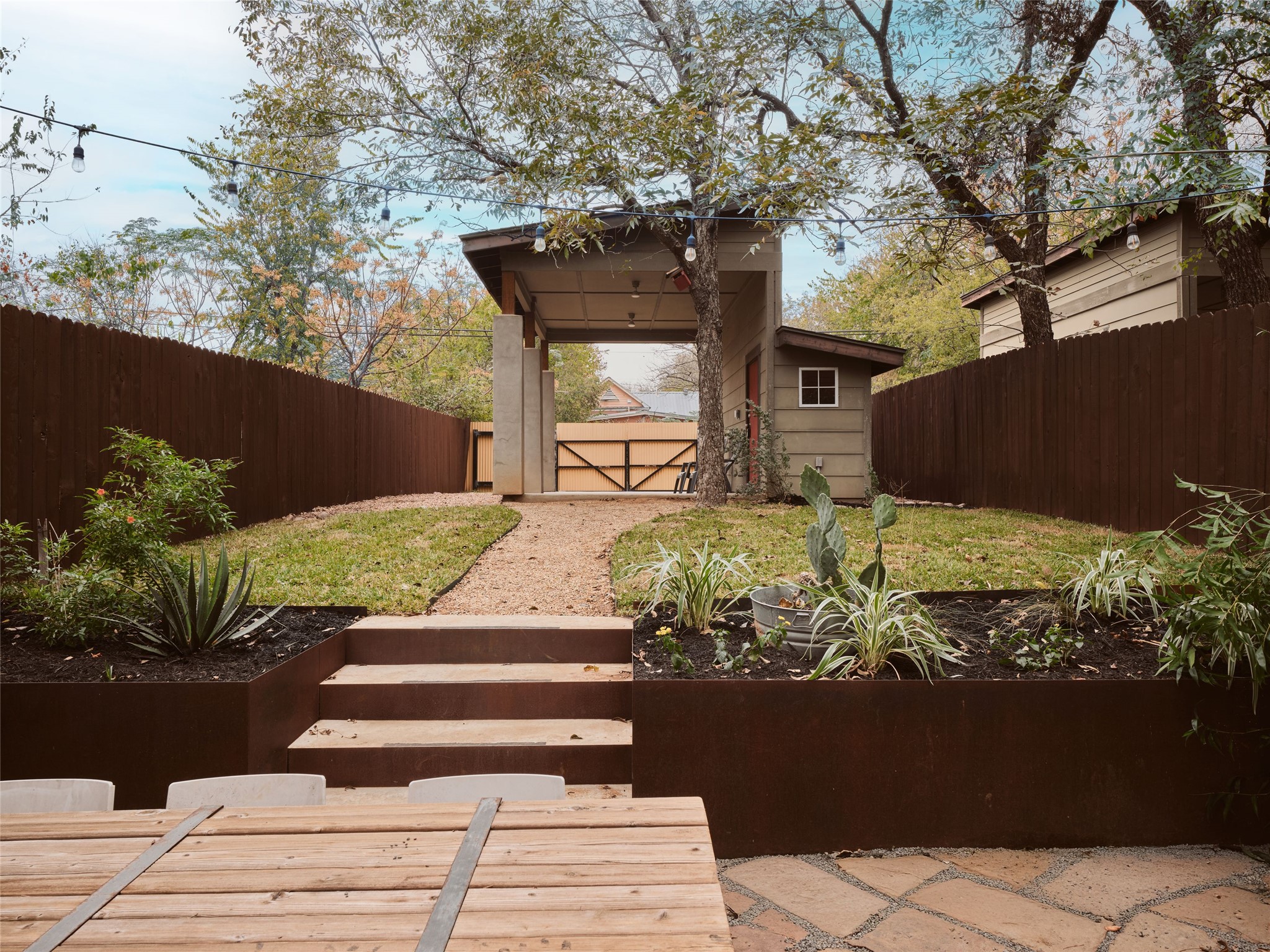 2002 East 13th Street, Unit A Austin, TX 78702 - Photo 5 of 37 Fenced backyard featuring an outdoor structure